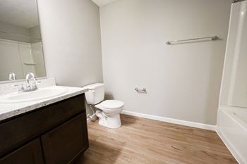An empty bathroom with a toilet and a sink